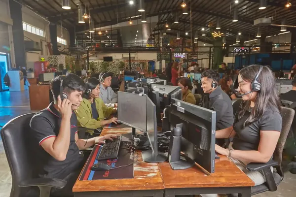 Clark office team members working at shared workstations in the Philippines
