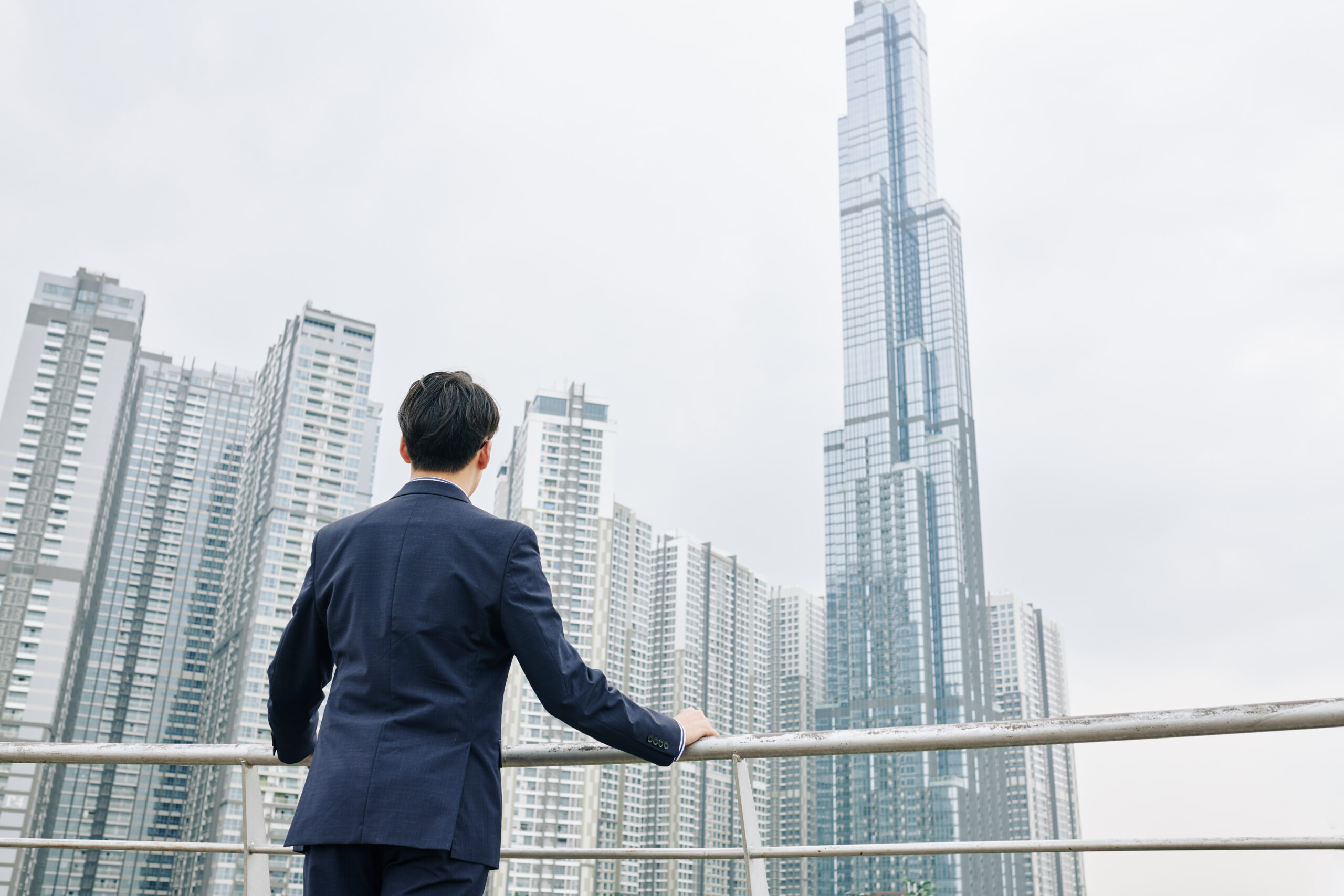 entrepreneur looking at city view from top of the building